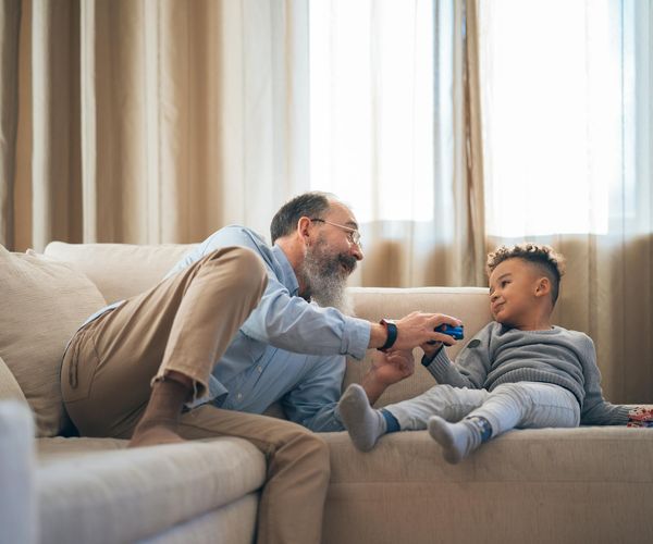 Cozy home corner set up for yoga with a mat and a candle.